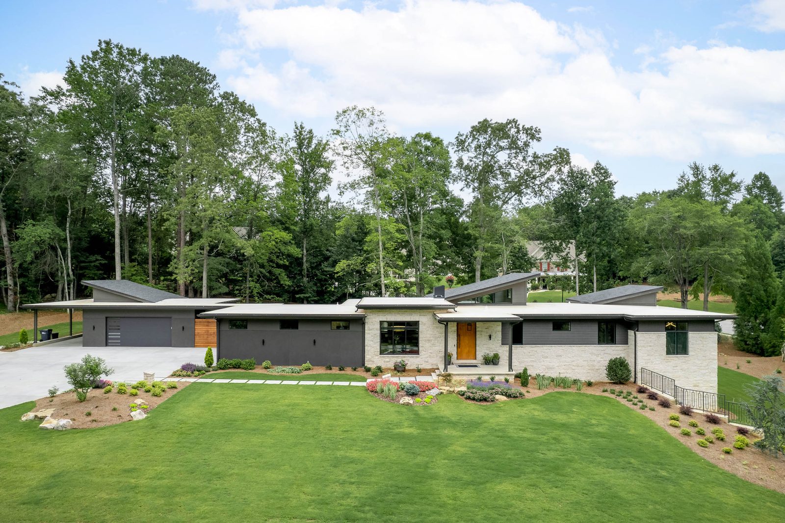 The house seen from across the front lawn — The Ortiz Home, custom home built by Ironwood Construction Group in Sugar Hill, Georgia