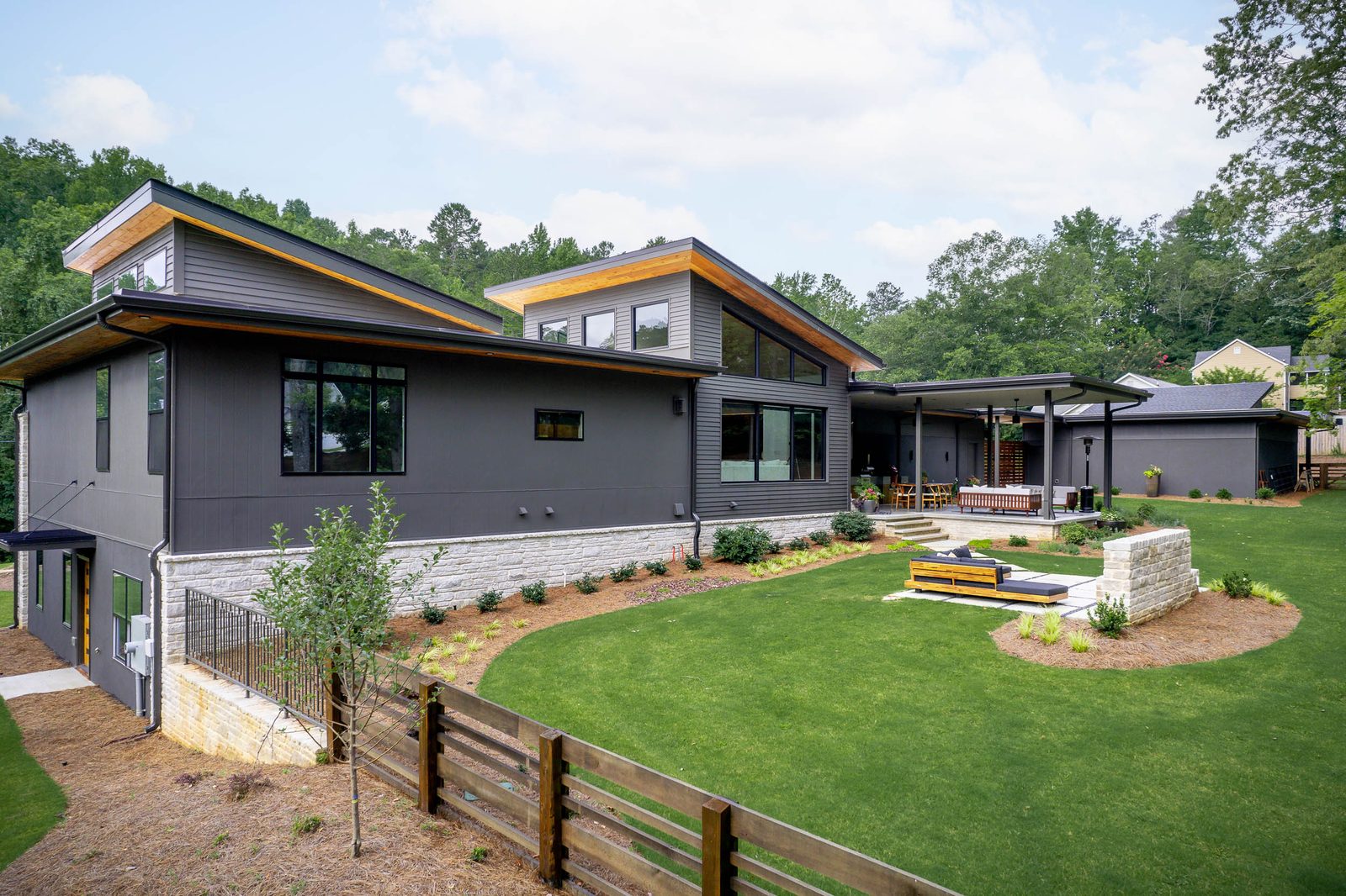 Rear elevation above the fenced yard and patio — The Ortiz Home, custom home built by Ironwood Construction Group in Sugar Hill, Georgia