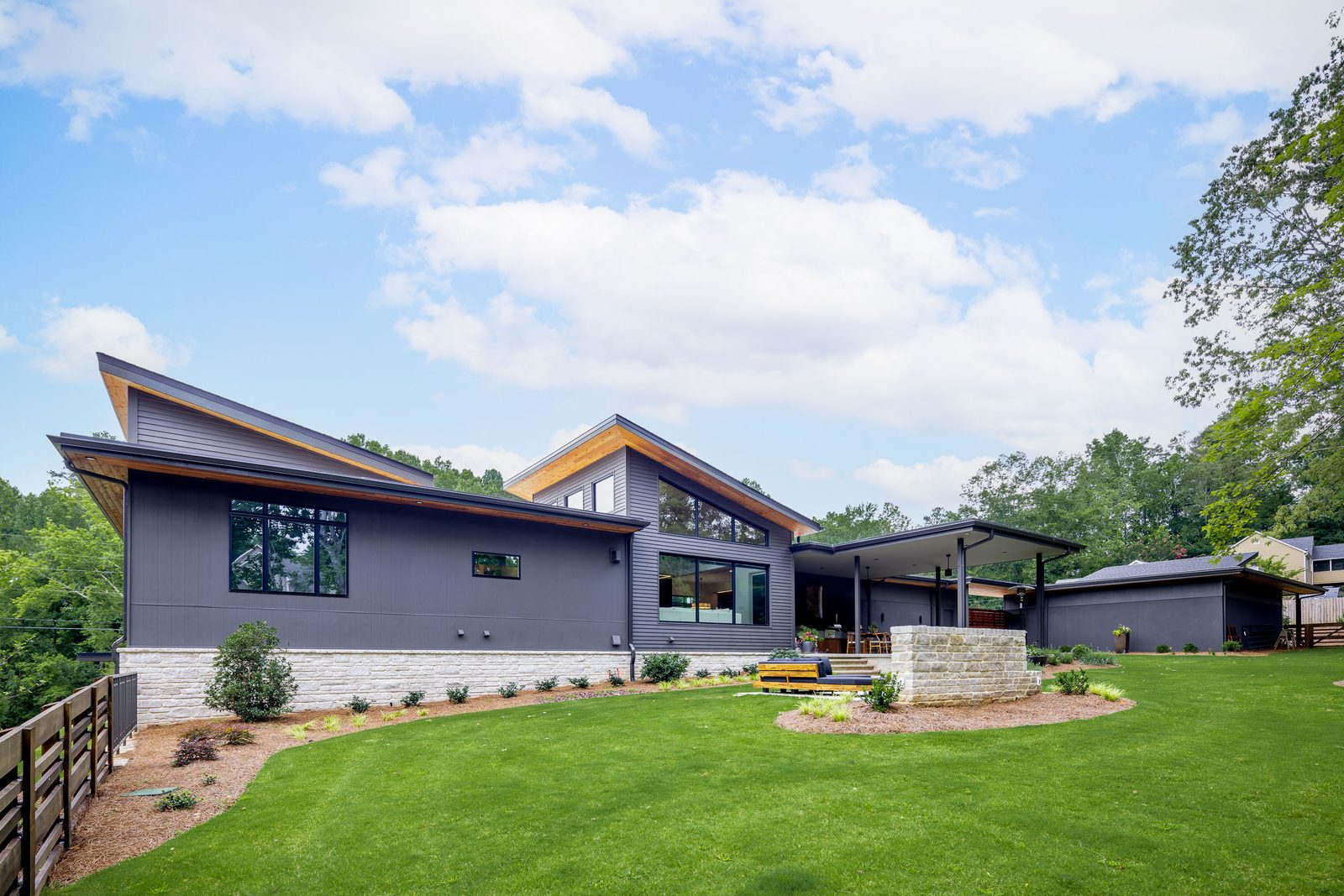 Rear elevation seen from the lawn — The Ortiz Home, custom home built by Ironwood Construction Group in Sugar Hill, Georgia