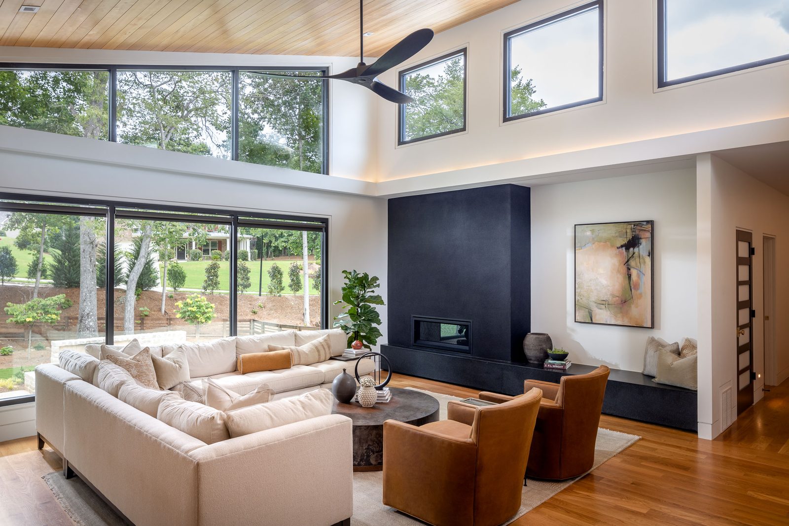 Living room with sectional and clerestory windows — The Ortiz Home, custom home built by Ironwood Construction Group in Sugar Hill, Georgia