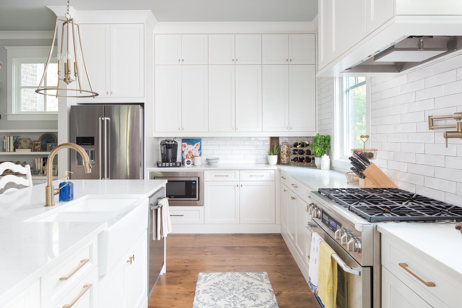 Kitchen with subway tile, gas range and apron-front sink — Austin Garner Rd, custom home built by Ironwood Construction Group