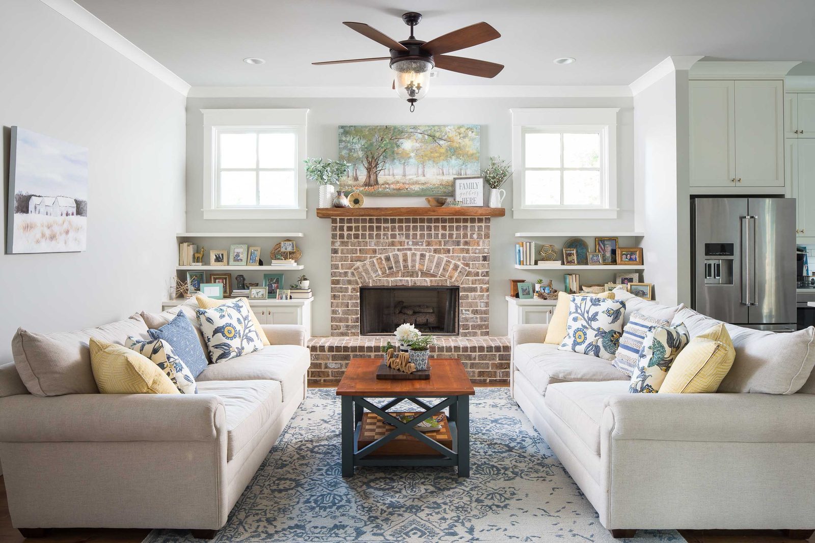 Living room with brick fireplace and flanking built-in shelves — Austin Garner Rd, custom home built by Ironwood Construction Group