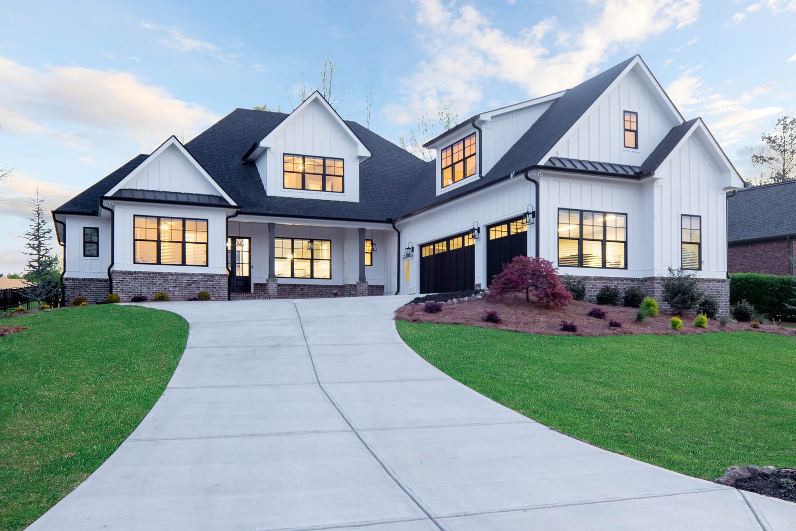 Wide front elevation across the lawn — Glausier, custom home built by Ironwood Construction Group