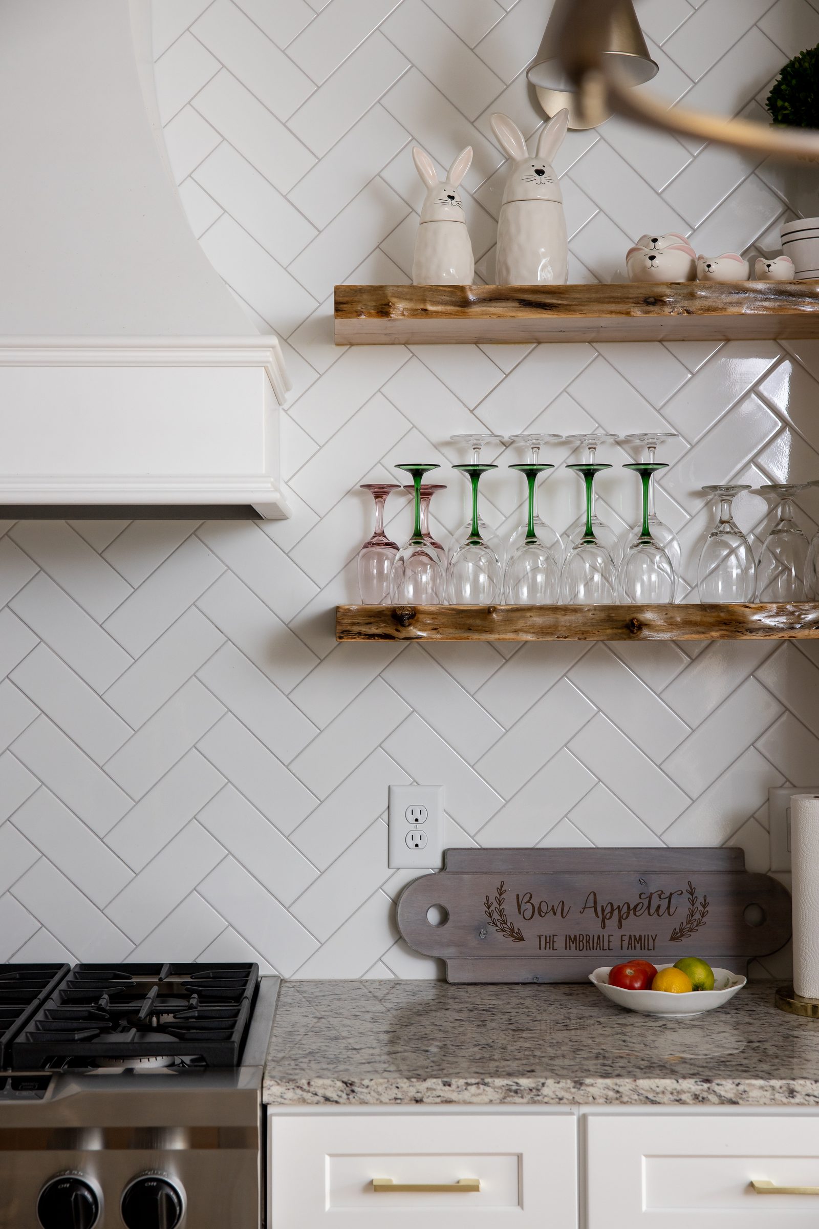 Kitchen backsplash in herringbone tile with floating wood shelves — Imbriale, custom home built by Ironwood Construction Group
