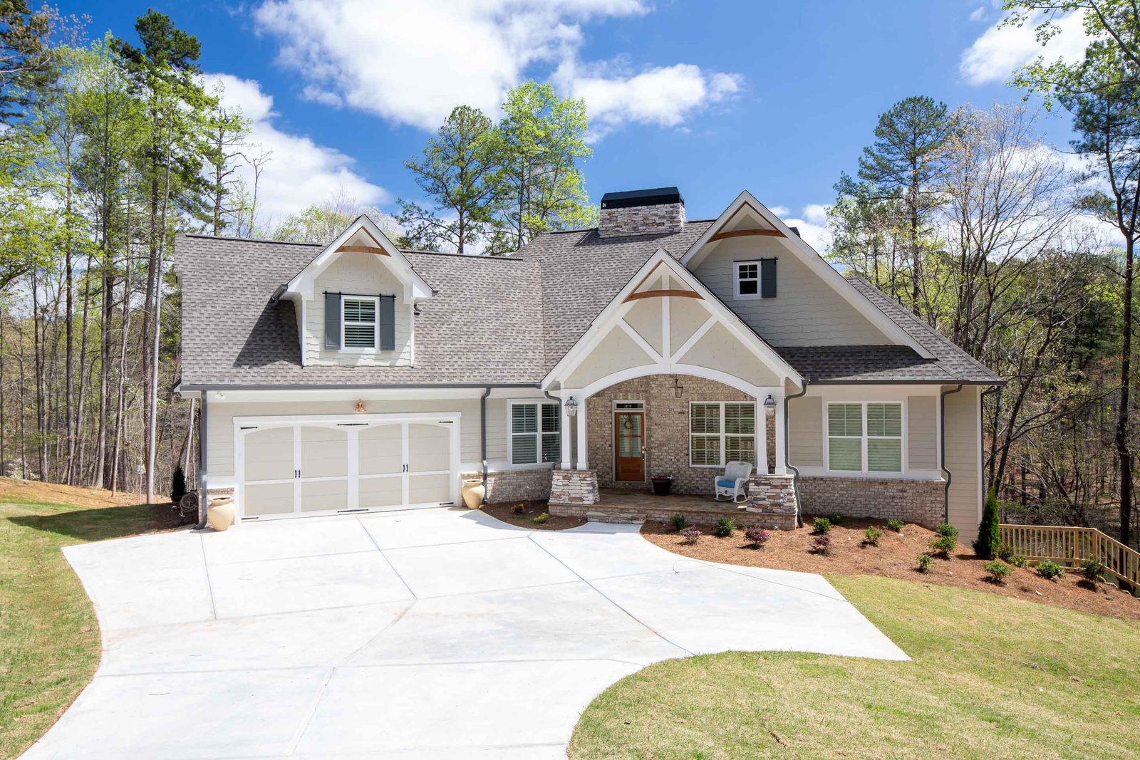 Craftsman front elevation with three-car garage and stone accents — Imbriale, custom home built by Ironwood Construction Group