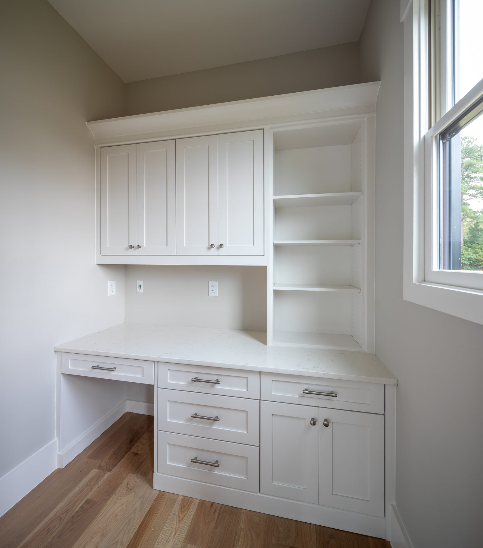Built-in desk nook with upper cabinets and open shelving — Shadburn Ferry, custom home built by Ironwood Construction Group in Buford, Georgia